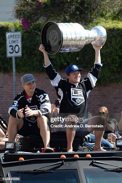 Tyler Toffoli of the Los Angeles Kings hoists the Stanley Cup during the Los Angeles Kings South Bay Victory Parade on June 18, 2014 in Hermosa...