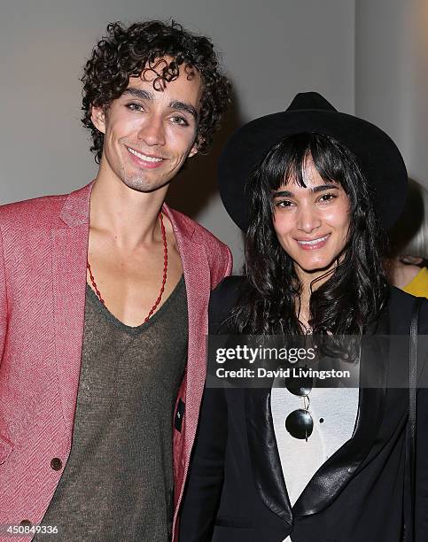 Actor Robert Sheehan and dancer Sofia Boutella attend the 2014 Los Angeles Film Festival screening of "The Road Within" at Regal Cinemas L.A. Live on...