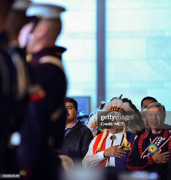 Wallace Coffey, right, Chairman of the Comanche Nation, back left, and other attendees watch the honor guard enter on Wednesday, Nov. 20 in...