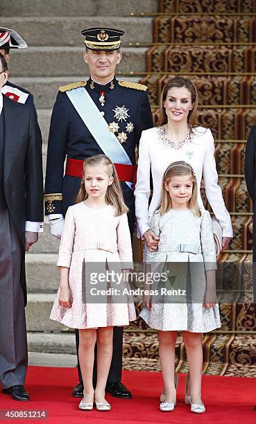 King Felipe VI of Spain and Queen Letizia of Spain pose with daughters Princess Leonor, Princess of Asturias and Princess Sofia infront of the Lions...