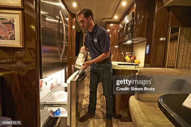 Ford EcoBoost 400: Portrait of Jimmie Johnson casual, putting Ketel One vodka into freezer of his RV in anticipation of his Sprint Cup Series...