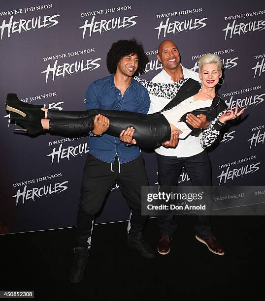 Krit Schmidt, Dwayne Johnson and Kate Peck walk the red carpet ahead of a screening of Hercules at Event Cinemas George Street on June 19, 2014 in...