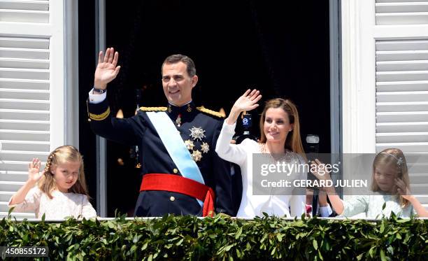 Princess of Asturias Leonor, Spain's King Felipe VI, Spain's Queen Letizia and Spanish Princess Sofia pose on the balcony of the Palacio de Oriente...