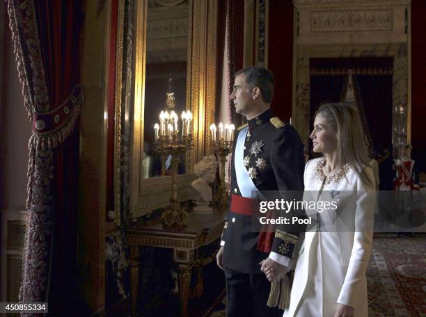 King Felipe VI of Spain and Queen Letizia of Spain prepare to appear at the balcony of the Royal Palace during the King's official coronation...