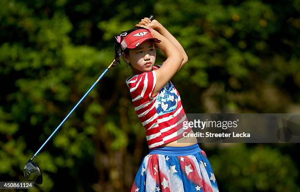Eleven-year old Amateur Lucy Li of the United States takes a practice swing on the third hole during the first round of the 69th U.S. Women's Open at...