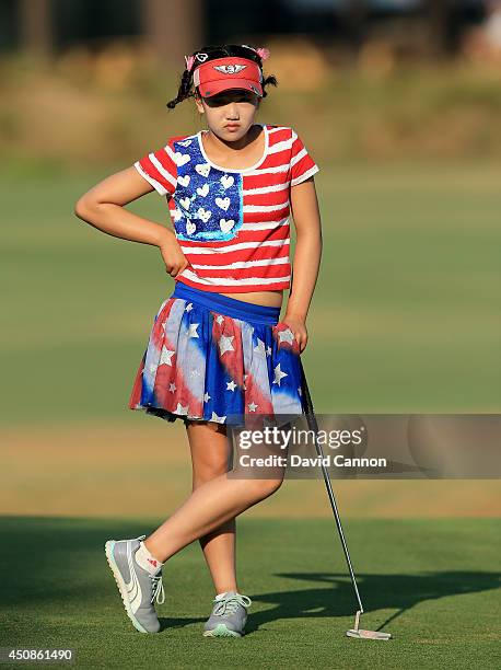 Lucy Li of the USA who is 11 years old waiting to putt on the 12th green during the first round of the 69th U.S. Women's Open at Pinehurst Resort &...