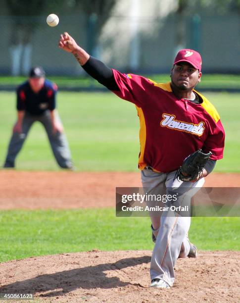 Juan Fuentes of Venezuela throws the ball during the baseball qualifiers match vs Ecuador as part of the XVII Bolivarian Games Trujillo 2013 at Villa...