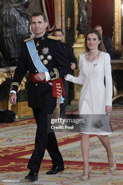 King Felipe VI of Spain and Queen Letizia of Spain attend a reception at the Royal Palace after the King's official coronation at the parliament on...