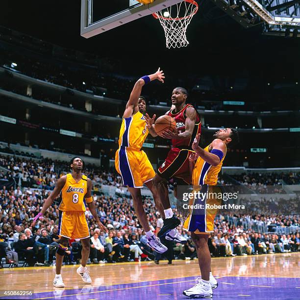 Lindsey Hunter of the Detroit Pistons drives to the basket against the Los Angeles Lakers on December 12, 2000 at Staples Center in Los Angeles, CA....
