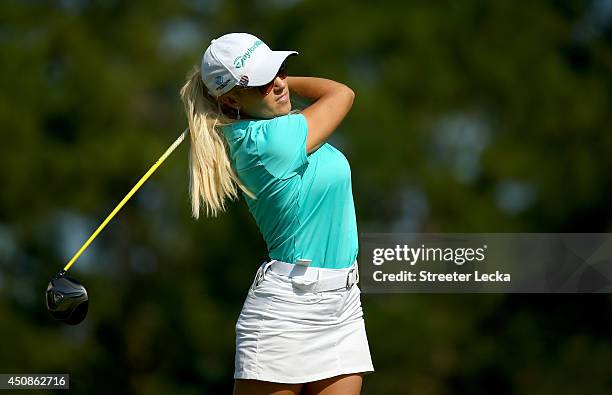 Natalie Gulbis of the United States hits a tee shot on the third hole during the first round of the 69th U.S. Women's Open at Pinehurst Resort &...