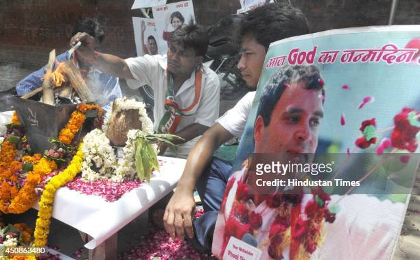 Congress party supporters offering hawan for blessing Congress Vice President Rahul Gandhi on his birthday ceremony out side AICC Office on June 19,...