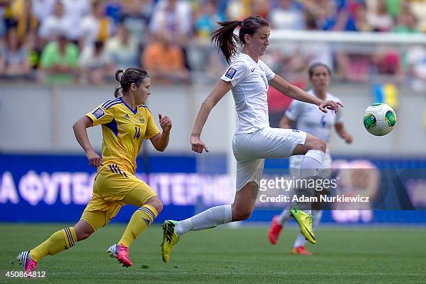 Jill Scott from England Women fights for the ball with Olha Ovdiychuk of Ukraine Women during the FIFA Women's World Cup 2015 Qualifier match between...