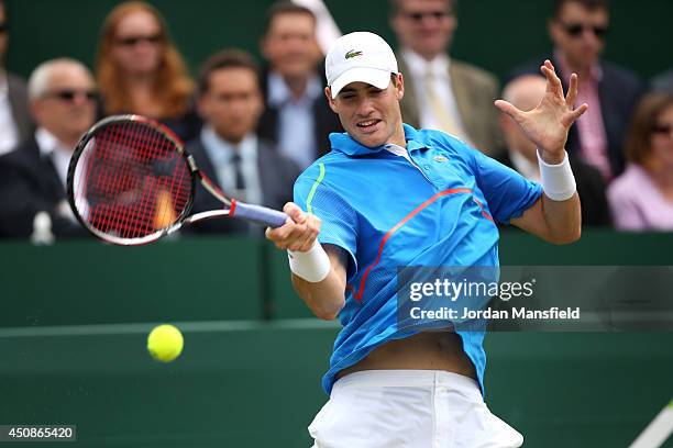 John Isner of the USA plays a forehand against Robin Haase of the Netherlands during day three of The Boodles Tennis Event at Stoke Park on June 19,...