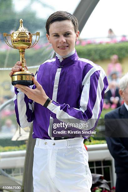 Jockey Joseph O'Brien poses with The Ribblesdale Stakes trophy after winning the race with horse Bracelet during day three of Royal Ascot at Ascot...