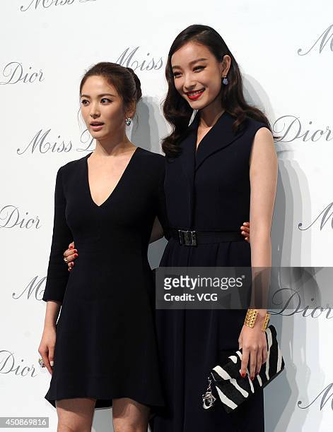 Actress Ni Ni and actress Song Hye-kyo attend Miss Dior exhibition at Shanghai Urban Sculpture Center on June 19, 2014 in Shanghai, China.