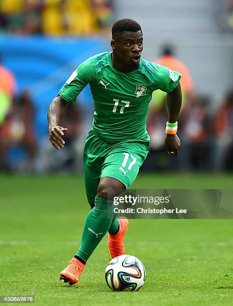 Serge Aurier of the Ivory Coast controls the ball during the 2014 FIFA World Cup Brazil Group C match between Colombia and Cote D'Ivoire at Estadio...