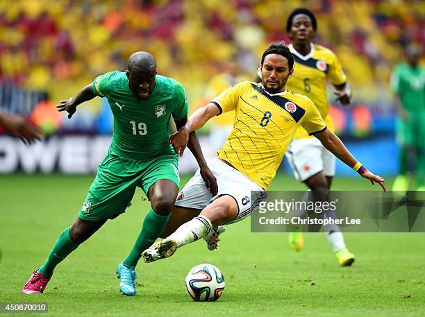 Yaya Toure of the Ivory Coast and Abel Aguilar of Colombia compete for the ball during the 2014 FIFA World Cup Brazil Group C match between Colombia...