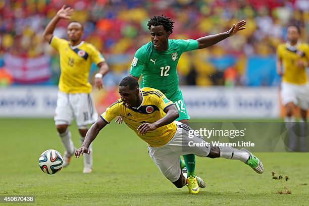 Wilfried Bony of the Ivory Coast and Cristian Zapata of Colombia compete for the ball during the 2014 FIFA World Cup Brazil Group C match between...