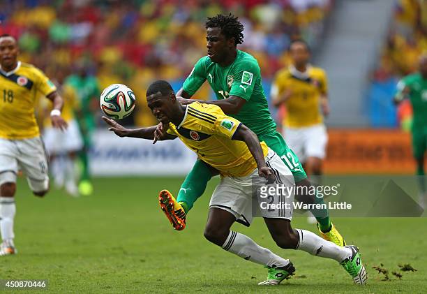 Wilfried Bony of the Ivory Coast and Cristian Zapata of Colombia compete for the ball during the 2014 FIFA World Cup Brazil Group C match between...