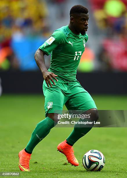 Serge Aurier of the Ivory Coast controls the ball during the 2014 FIFA World Cup Brazil Group C match between Colombia and Cote D'Ivoire at Estadio...