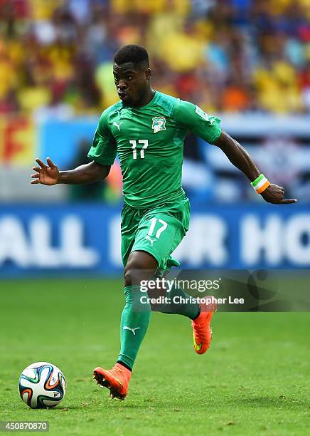 Serge Aurier of the Ivory Coast controls the ball during the 2014 FIFA World Cup Brazil Group C match between Colombia and Cote D'Ivoire at Estadio...