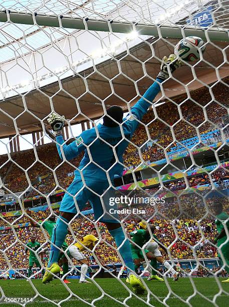 James Rodriguez of Colombia scores his team's first goal on a header past goalkeeper Boubacar Barry of the Ivory Coast during the 2014 FIFA World Cup...