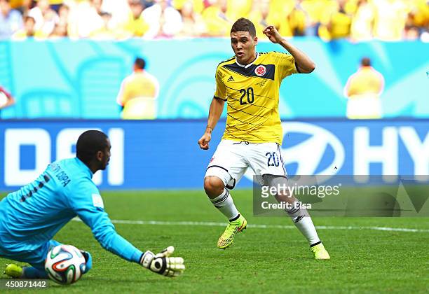 Juan Fernando Quintero of Colombia scores his team's second goal past Boubacar Barry of the Ivory Coast during the 2014 FIFA World Cup Brazil Group C...