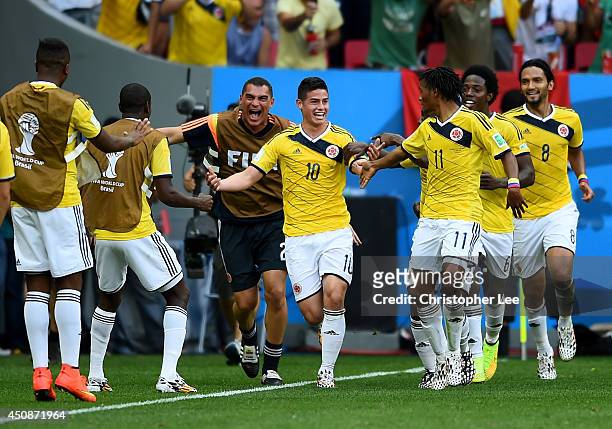 James Rodriguez of Colombia celebrates by dancing with teammates after scoring his team's first goal during the 2014 FIFA World Cup Brazil Group C...