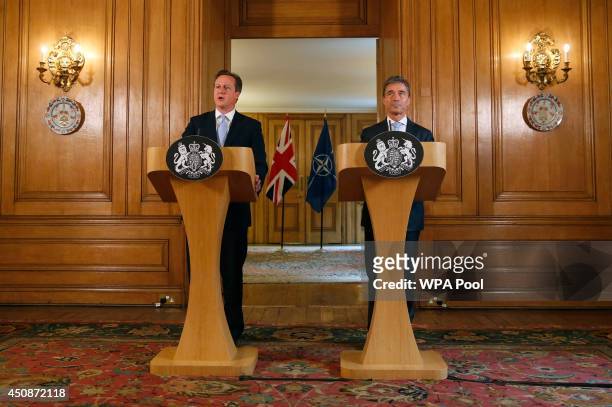 Britain's Prime Minister David Cameron and NATO Secretary-General Anders Fogh Rasmussen hold a joint news conference in Downing Street on June 19,...