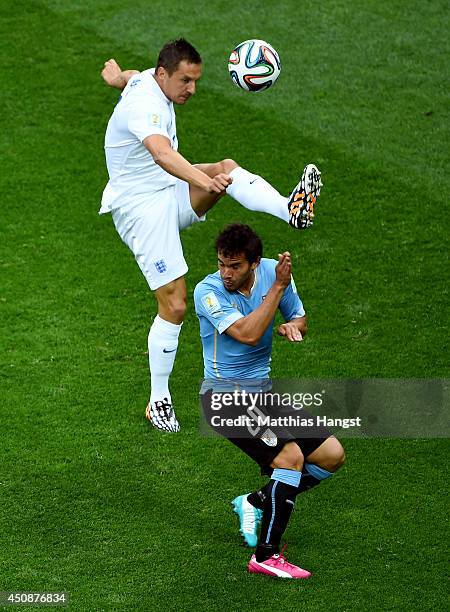 Phil Jagielka of England competes for the ball wtih Alvaro Gonzalez of Uruguay during the 2014 FIFA World Cup Brazil Group D match between Uruguay...