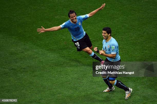 Luis Suarez of Uruguay celebrates scoring his team's first goal with Alvaro Gonzalez during the 2014 FIFA World Cup Brazil Group D match between...