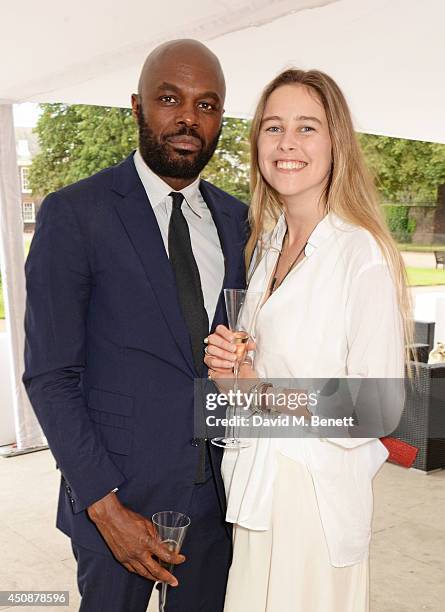 Christopher Obi and Maddison Brudenell attend the drinks reception hosted by Dockers, the San Francisco based apparel brand, at Kensington Palace on...