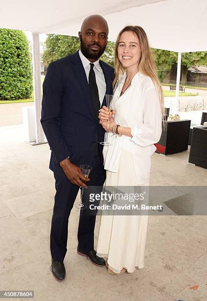 Christopher Obi and Maddison Brudenell attend the drinks reception hosted by Dockers, the San Francisco based apparel brand, at Kensington Palace on...