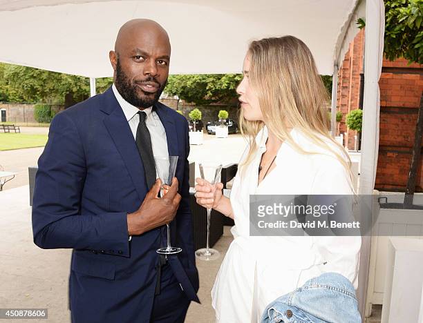 Christopher Obi and Maddison Brudenell attend the drinks reception hosted by Dockers, the San Francisco based apparel brand, at Kensington Palace on...