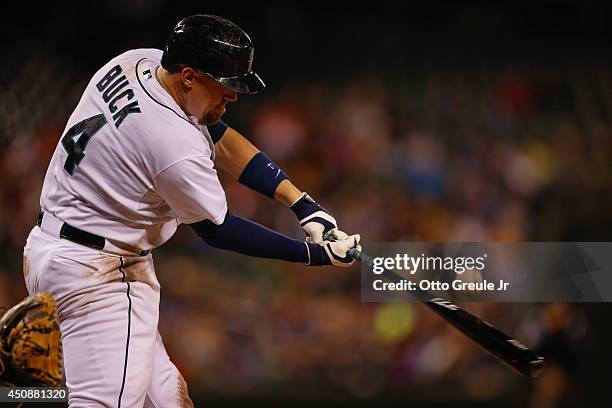 John Buck of the Seattle Mariners bats against the Texas Rangers at Safeco Field on June 14, 2014 in Seattle, Washington.