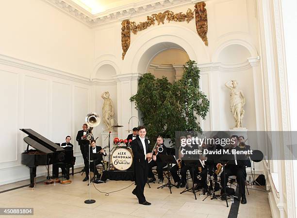 Alex Mendham & His Orchestra perform at the drinks reception hosted by Dockers, the San Francisco based apparel brand, at Kensington Palace on the...