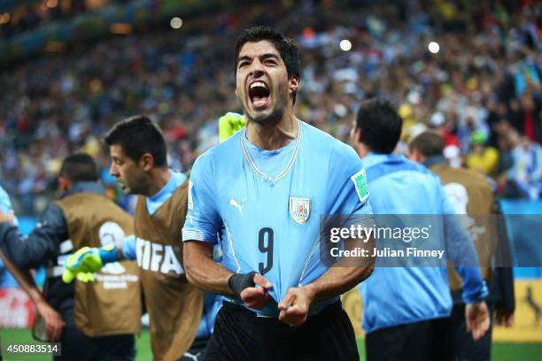 Luis Suarez of Uruguay celebrates after scoring his team's second goal during the 2014 FIFA World Cup Brazil Group D match between Uruguay and...