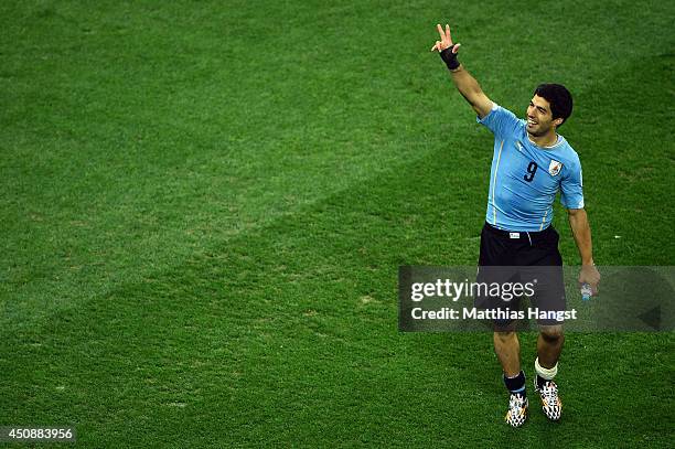 Luis Suarez of Uruguay acknowledges the fans after defeating England 2-1 during the 2014 FIFA World Cup Brazil Group D match between Uruguay and...