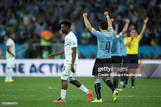 Jorge Fucile of Uruguay celebrates as a dejected Daniel Sturridge of England looks on after Uruguay's 2-1 win during the 2014 FIFA World Cup Brazil...