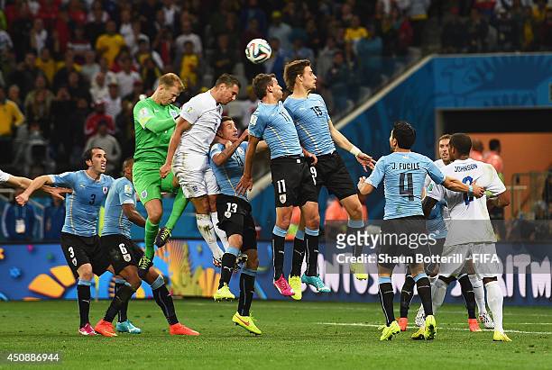 Joe Hart and Phil Jagielka of England, Christian Stuani and Sebastian Coates of Uruguay compete for the ball during the 2014 FIFA World Cup Brazil...