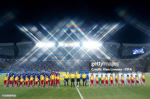 Players line up prior to the 2014 FIFA World Cup Brazil Group C match between Japan and Greece at Estadio das Dunas on June 19, 2014 in Natal, Brazil.