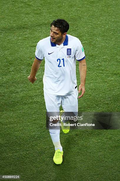 Konstantinos Katsouranis of Greece is sent off after being given a second yellow and red card during the 2014 FIFA World Cup Brazil Group C match...