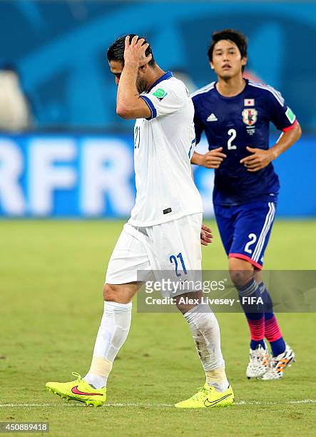 Konstantinos Katsouranis of Greece walks off the pitch after receiving a red card during the 2014 FIFA World Cup Brazil Group C match between Japan...