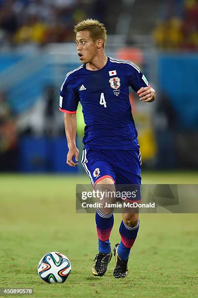 Keisuke Honda of Japan controls the ball during the 2014 FIFA World Cup Brazil Group C match between Japan and Greece at Estadio das Dunas on June...