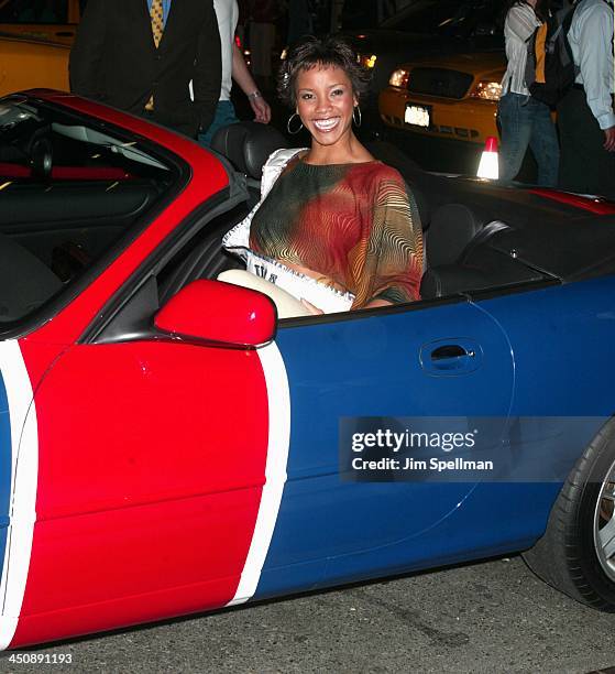 Shauntay Hinton, Miss USA 2002, sits in Austin Powers's XK8 Union Jack Jaguar convertible