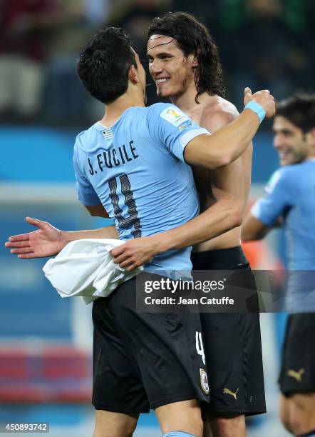 Jorge Fucile and Edinson Cavani of Uruguay celebrate the victory at the end of the 2014 FIFA World Cup Brazil Group D match between Uruguay and...