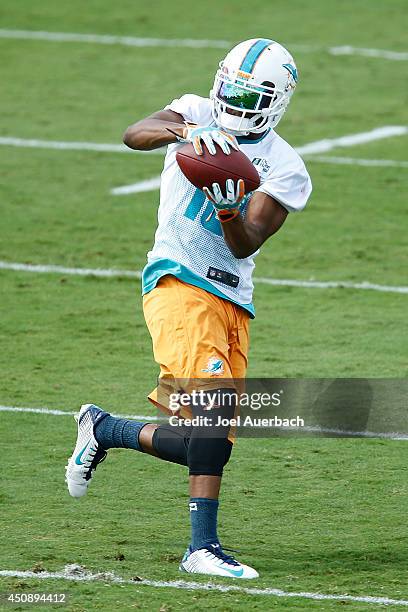 Brandon Gibson of the Miami Dolphins participates in drills during the minicamp on June 19, 2014 at the Miami Dolphins training facility in Davie,...