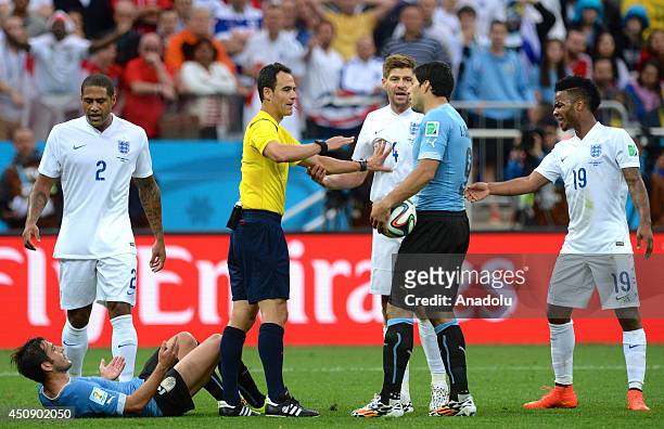 Referee Carlos Velasco Carballo reacts during the 2014 FIFA World Cup Group D match between Uruguay and England at Arena de Sao Paulo Stadium in Sao...