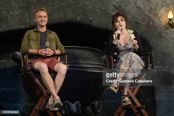 Tom Felton and Helena Bonham Carter are interviewed at The Wizarding World Of Harry Potter Diagon Alley at Universal Orlando on June 19, 2014 in...
