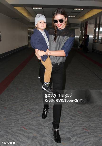 November 20: Miranda Kerr and baby Flynn Christopher Bloom are seen arriving at LAX airport on November 20, 2013 in Los Angeles, California.